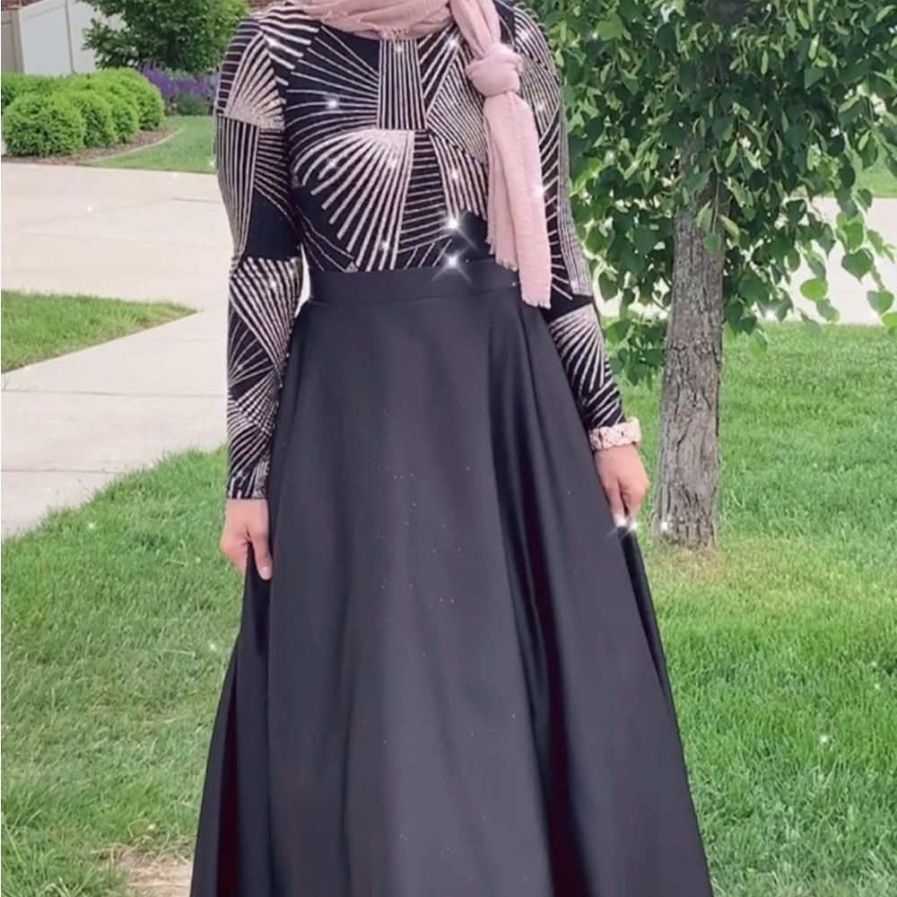 Beaded bodice long sleeve ball gown